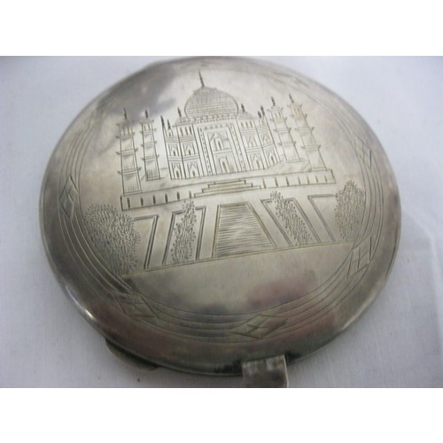 201 - A Indian sterling silver compact, a map of India inscribed to one side and an image of the Taj Mahal... 