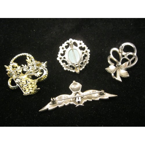 186 - 4 vintage brooches including an RAF sweetheart brooch with enamel finish and King's crown, all in wh... 