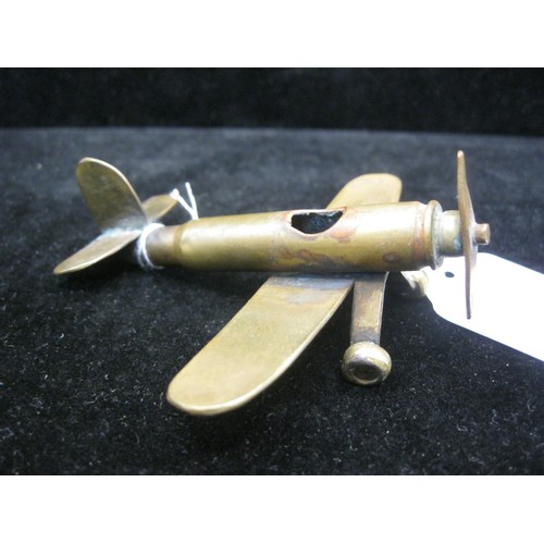 192 - A trench art Monoplane aircraft made from bits of brass with an inert shell case as a fuselage. Wing... 