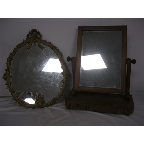 198 - A vintage ormulu style mirror and a dressing table mirror on stand, both in good order