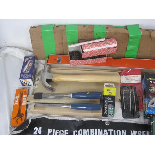 106 - A large box of tools to include a level, various saws, socket  set, new hammer, new chisels and many... 