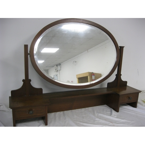 3 - A large oval dressing table mirror on matching stand with drawers, bevel edged and with minor desilv... 