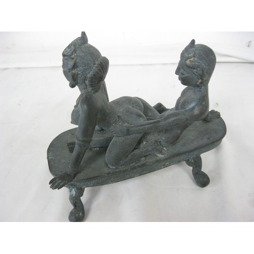 25 - A cast bronze Hindu erotic figure featuring a couple copulating, explicit, likely late 19th or early... 