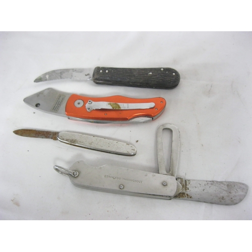 37 - A stainless steel likely military clasp knife plus three others