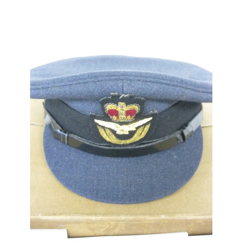 4 - An RAF officer's peaked cap in original box, Queen's crown, , size 7 1/8