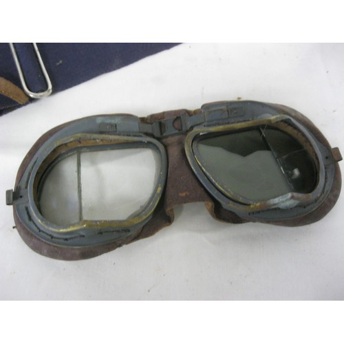 5 - A pair of WW2 Mark VIII RAF pilot's goggles with angled eye-pieces, metal framed with leather paddin... 