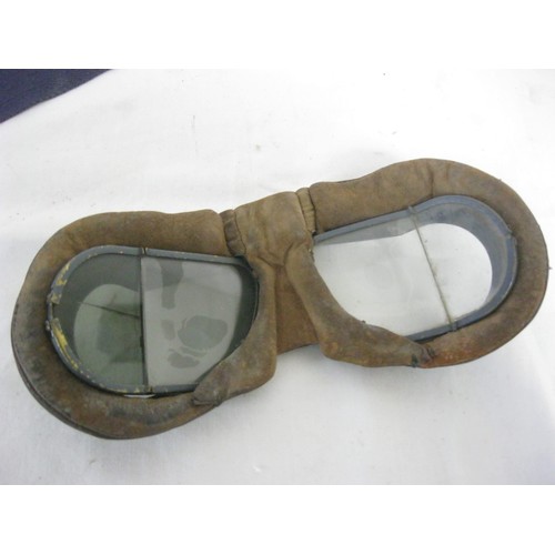 5 - A pair of WW2 Mark VIII RAF pilot's goggles with angled eye-pieces, metal framed with leather paddin... 