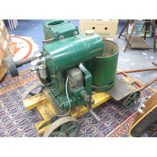 2 - A Lister D stationary petrol engine, apparently complete, on wheeled trolley, the wheels of cast iro... 