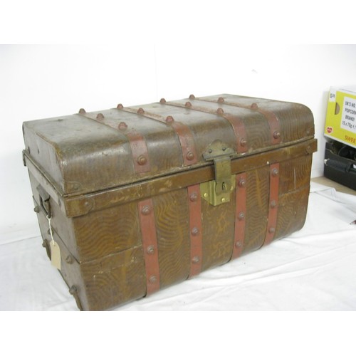 61 - An early 20th century tin trunk with handles and its original paintwork, 66cms wide by 43cms deep an... 