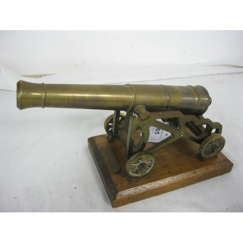 65 - (472) A brass desk top signal cannon modelled on a circa 1850 Garrison Gun. The barrel having a leng... 