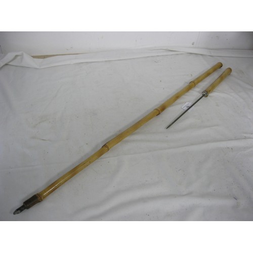 73 - (480) A bamboo shafted sword stick with a 23cms square blade, with an overall length of 111cms.