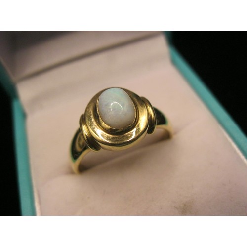 39 - A 9 carat gold dress ring set with an opalescent stone, ring size R, gross weight approx. 3.3g, stam... 