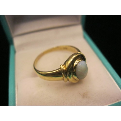 39 - A 9 carat gold dress ring set with an opalescent stone, ring size R, gross weight approx. 3.3g, stam... 