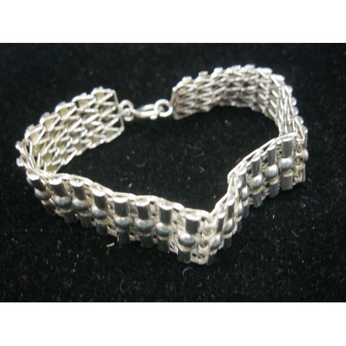 43 - An unusual 925 white metal bracelet of mesh and ball links, approx. 20.9g, length about 17cm, some a... 