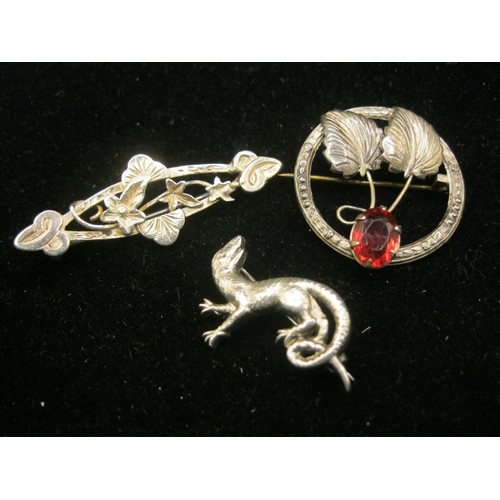 45 - Three vintage and antique silver brooches, with a presentation box. (1) A Victorian silver foliate b... 