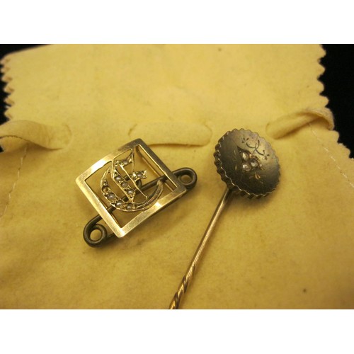 47 - A stick pin set with three diamonds, and a yellow metal initial G brooch. (1) A lapel or hat pin, ta... 