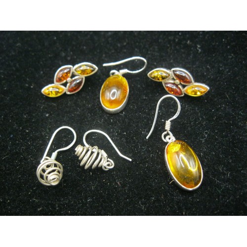 48 - Three pairs of 925 white metal earrings. Two of the pairs set with amber type stones, the other pair... 