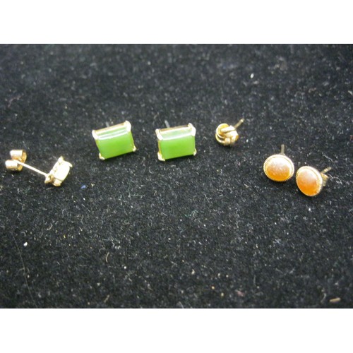 50 - A pair of stud earrings, one stamped 9CT; a pair of jade style earrings; one yellow metal ear stud m... 