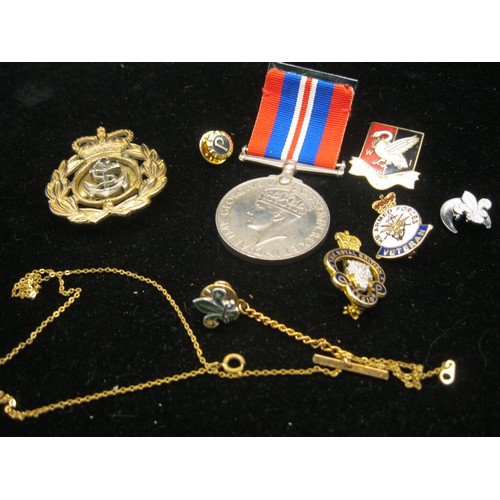 52 - A 1939-1945 War Medal with ribbon, a Royal Navy beret badge, a Bucks WI enamel badge, a Royal Britis... 