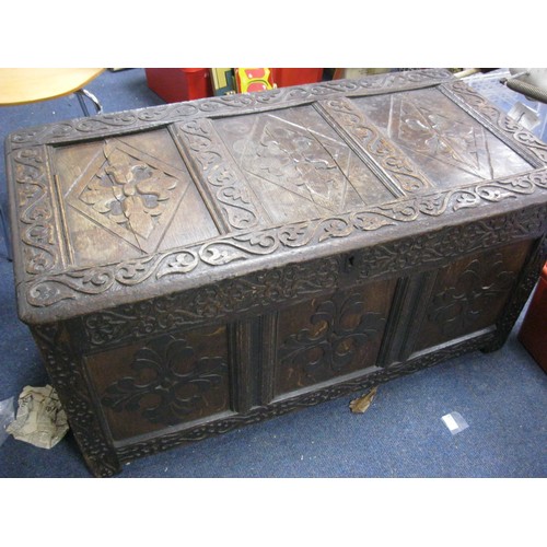 7 - A 17th century carved wooden coffer, splits to top panel but parts present, for restoration