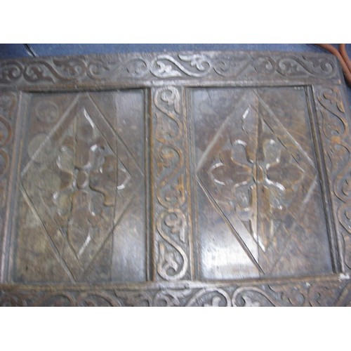 7 - A 17th century carved wooden coffer, splits to top panel but parts present, for restoration