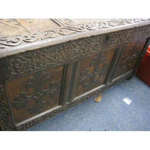 7 - A 17th century carved wooden coffer, splits to top panel but parts present, for restoration