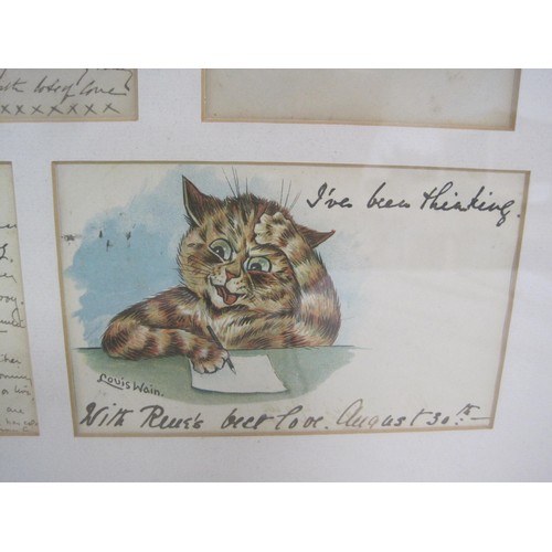 6 - A framed group of seven Louis Wain cat postcards. The postcards are captioned 'A Pretty kettle of fi... 