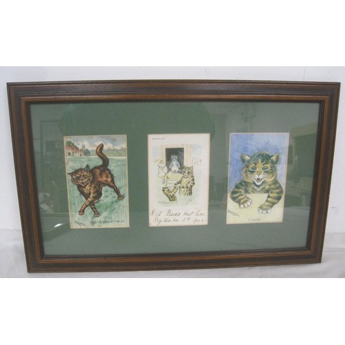 7 - Two framed groups of Louis Wain cat and dog postcards, each containing three postcards. Cards are ca... 