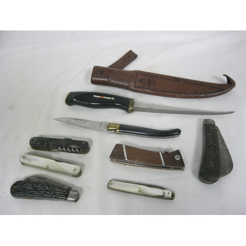 56 - An assortment of knives including a Nordmark fishing knife in sheath and a number of pocket knives.