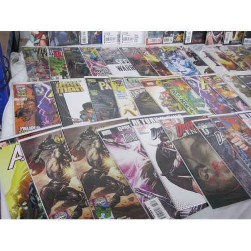 64 - A selection of 50 Marvel comics, mix of new and vintage, all in plastic wraps with cardboard backing... 