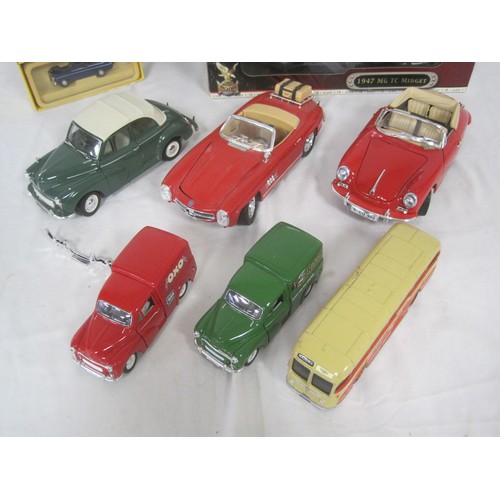 65 - A selection of 1.18 diecast cars two boxed three unboxed in fair condition along with three other di... 