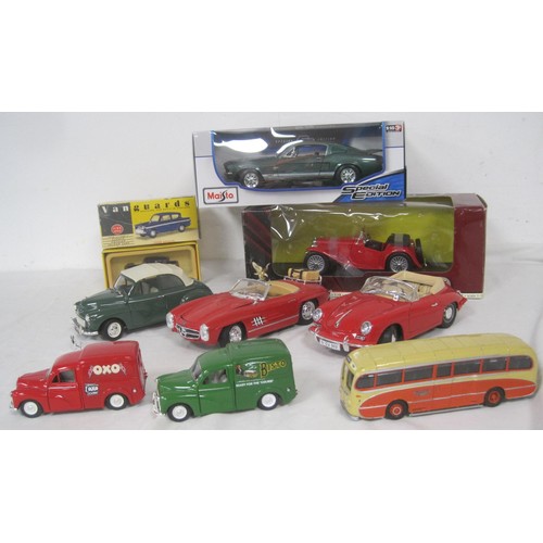 65 - A selection of 1.18 diecast cars two boxed three unboxed in fair condition along with three other di... 