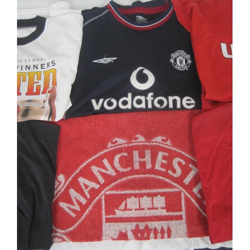 79 - An assortment of Manchester United shirts, mainly souvenir including Treble Winners 1999, a training... 