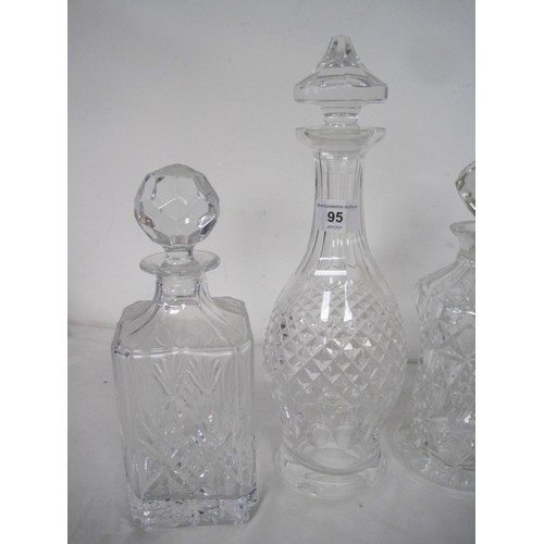 95 - Five decanters - a Waterford slice cut decanter with spire stopper, 33cm, very good; Edinburgh Cryst... 