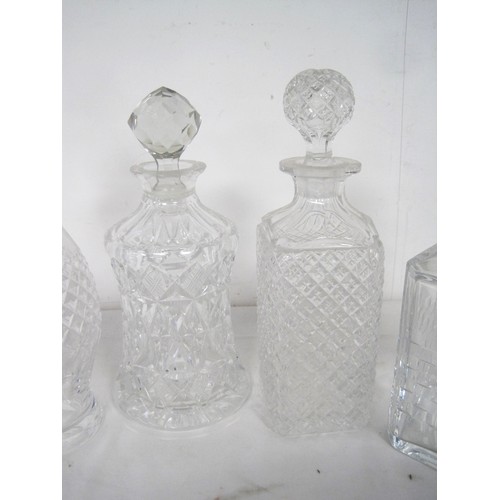 95 - Five decanters - a Waterford slice cut decanter with spire stopper, 33cm, very good; Edinburgh Cryst... 