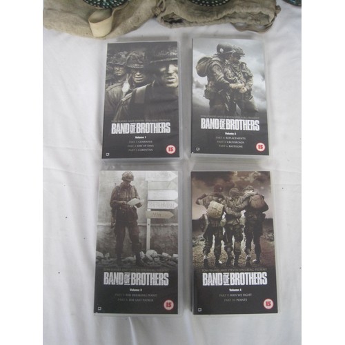 99 - A bag containing 4 vintage gas masks, a collection of Band of Brothers DVDs and a pair supposedly Na... 