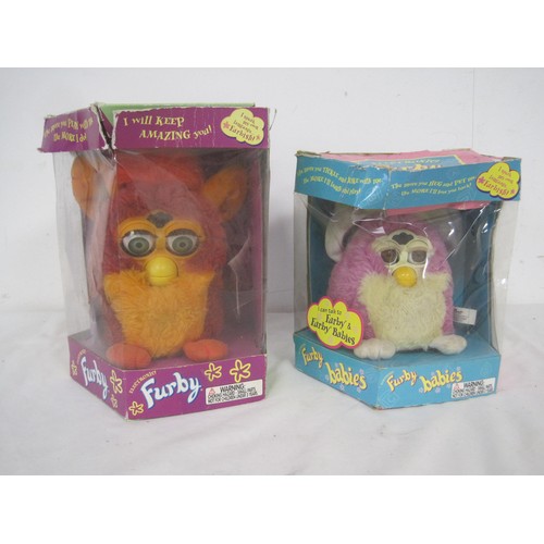 103 - A pair of Furby's in their original boxes, a Disney's Bambi framed and glazed picture and three fram... 