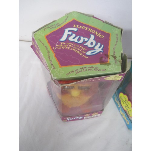 103 - A pair of Furby's in their original boxes, a Disney's Bambi framed and glazed picture and three fram... 