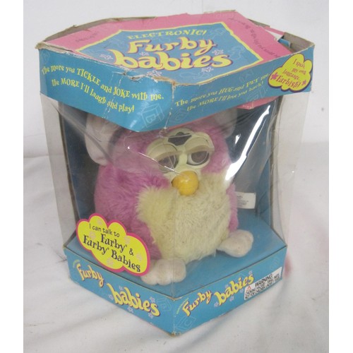 103 - A pair of Furby's in their original boxes, a Disney's Bambi framed and glazed picture and three fram... 