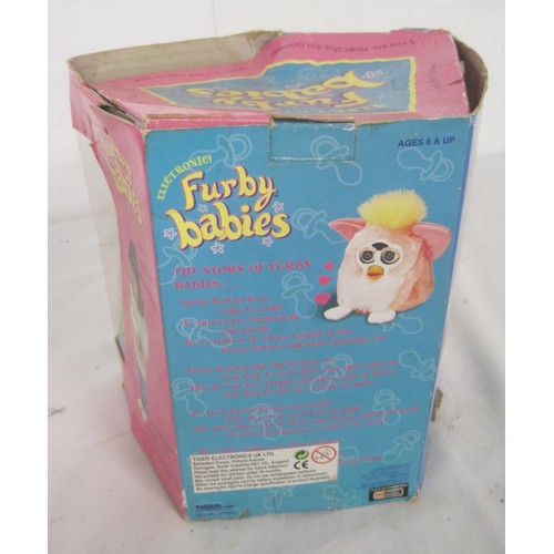 103 - A pair of Furby's in their original boxes, a Disney's Bambi framed and glazed picture and three fram... 