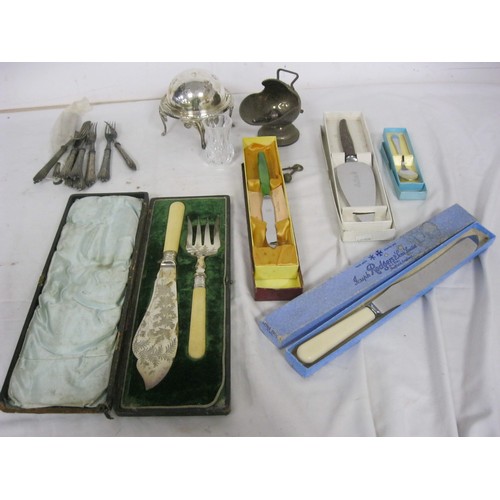 123 - A tub containing silver plate items including boxed cutlery