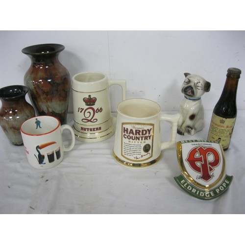 131 - An Eldridge Pope ceramic beer pump clip, various ceramic tankards including Thomas Hardy Country, Gu... 