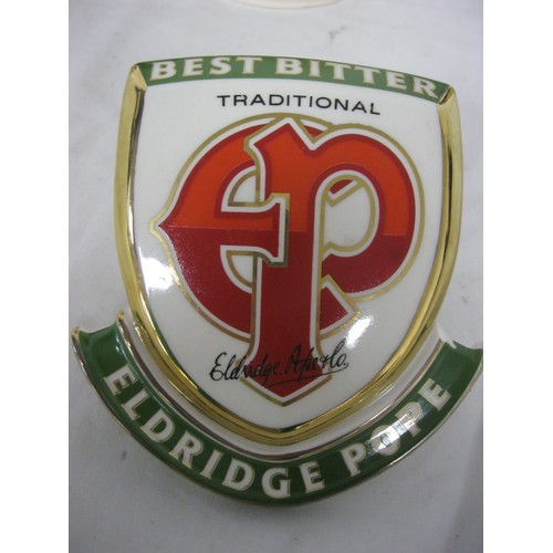 131 - An Eldridge Pope ceramic beer pump clip, various ceramic tankards including Thomas Hardy Country, Gu... 