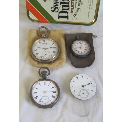 21 - A/f pocket watches in a Sweet Dublin Mixture tobacco tin. A pocket watch movement and glass; a gold-... 