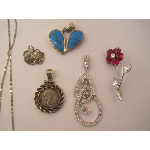 28 - A small quantity of white metal jewellery stamped 925 and silver - a flower brooch, a dramatic mask ... 