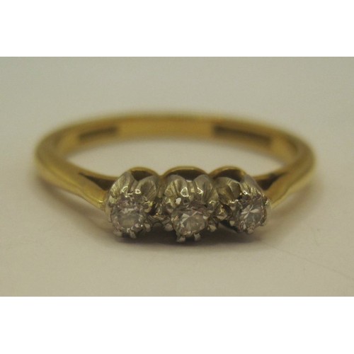 29 - An 18 carat gold three-stone diamond ring, size O/P, gross weight of ring 2.9g, stamped Bravingtons ... 