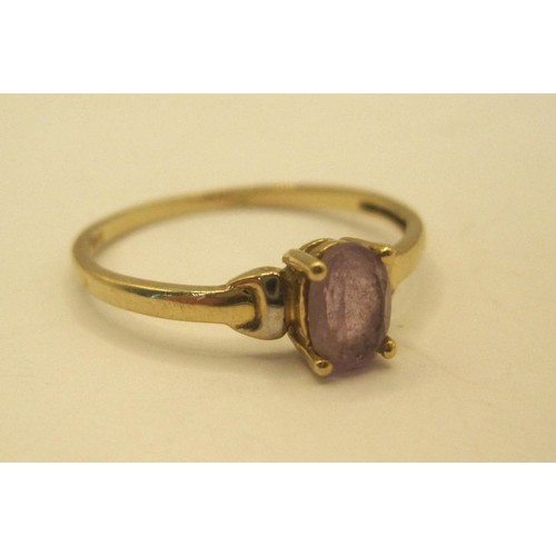 30 - A 9 carat gold ring set with an oval cut amethyst, ring size O, gross weight of ring approx. 0.9g, s... 