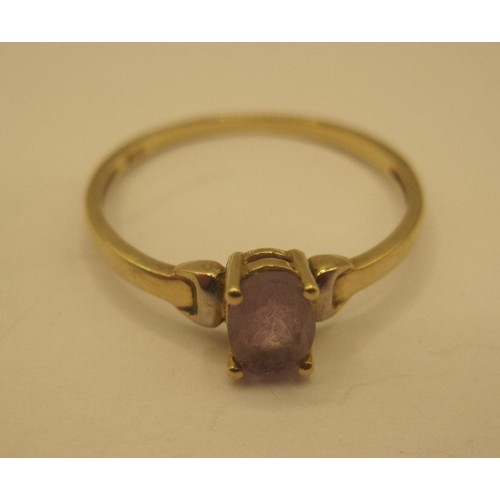 30 - A 9 carat gold ring set with an oval cut amethyst, ring size O, gross weight of ring approx. 0.9g, s... 