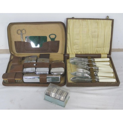 16 - A cased set of six stainless steel fish eaters, an a/f near complete gents grooming set in leather c... 