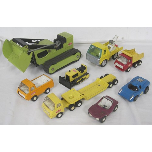 42 - A selection of Tonka toy model trucks including a smaller scale Articulated low loader all as per pi... 